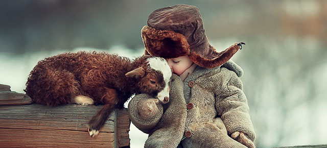 Russian Photographer Captures Adorable Photos Of Animals And Kids Playing In Snow