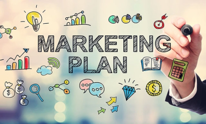 Businessman drawing Marketing Plan concept on blurred abstract background