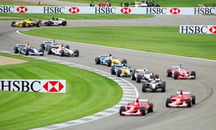 Formula One cars wind through the infield section of Indianapolis Motor Speedway at the 2003 United States Grand Prix