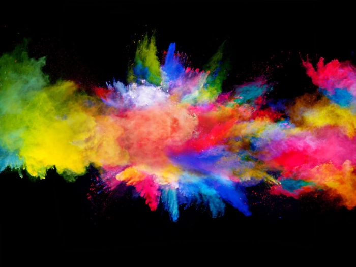 Explosion of colored powder, isolated on black background