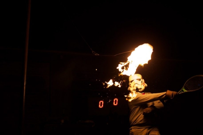 Tennis with a burning roll of toilet paper