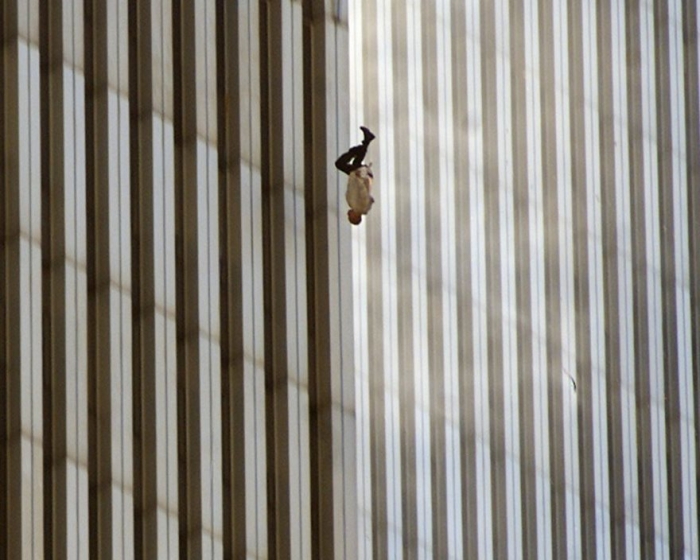 SEVENTH IN A SERIES OF ELEVEN-- A person falls from the north tower of New York's World Trade Center Tuesday Sept. 11, 2001after terrorists crashed two hijacked airliners into the World Trade Center and brought down the twin 110-story towers. (AP Photo/Richard Drew)